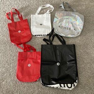 Lululemon (4) and one Athleta tote bags